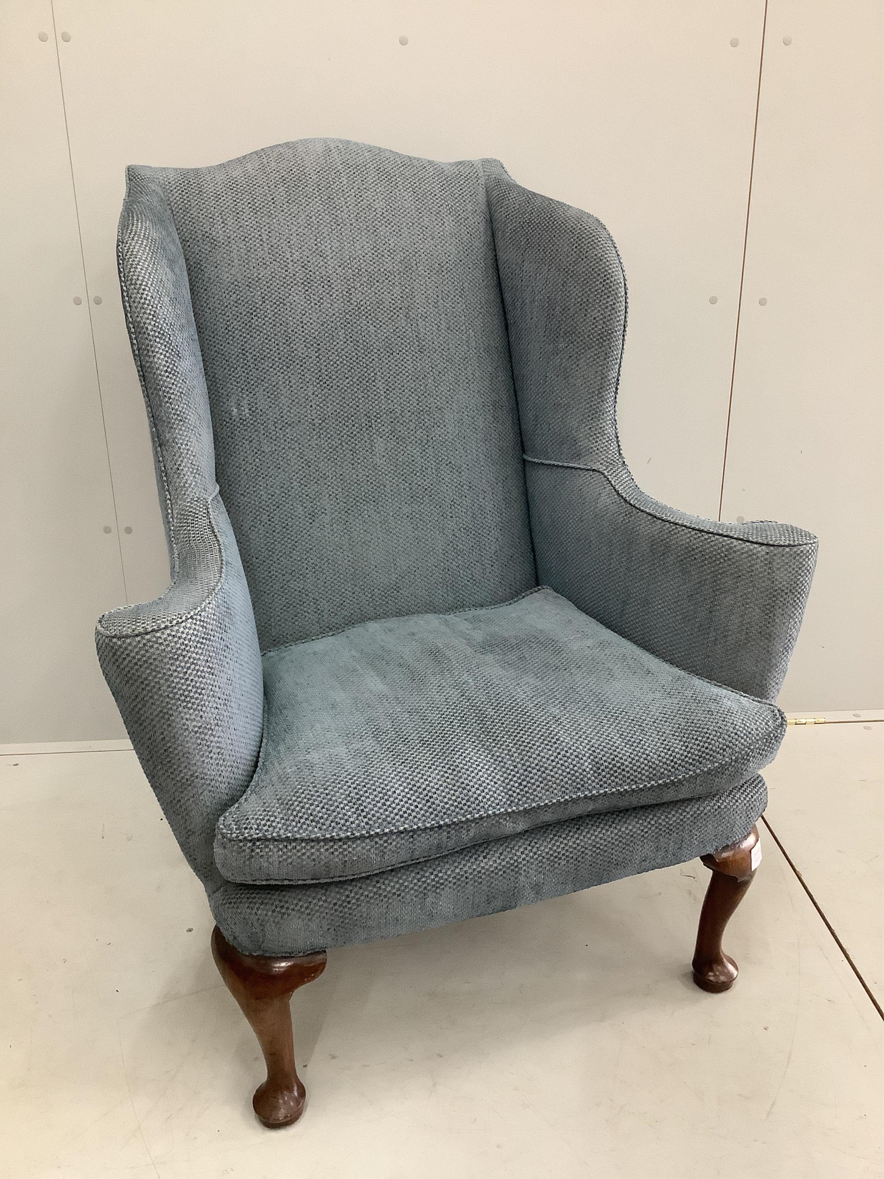 A George I walnut wing armchair, upholstered in blue fabric. Condition - good
